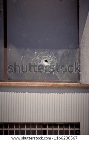 old window with a broken glass