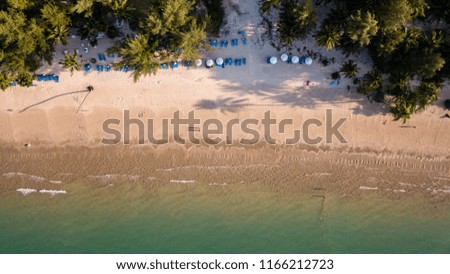 Beautiful late evening shadows on a deserted tropical beach viewed from the air