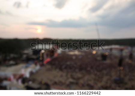 abstract blurred unfocused aerial crowd of people shot from above 