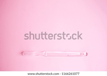top view personal care products. transparent toothbrush on pink background, minimalism, copy space, Flat lay