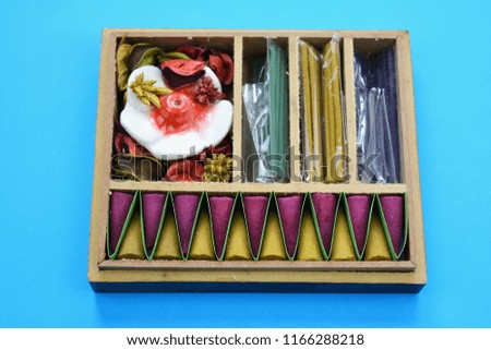 New full indian incense wooden box on blue background