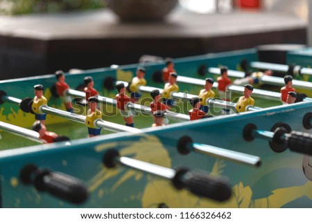 Close up of plastic table football game on street