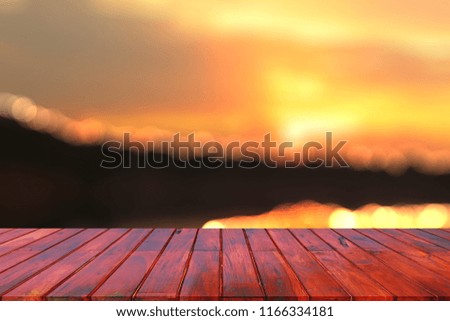 Wood table in front of the background of holiday blurring - Can be used to display or edit your product.
