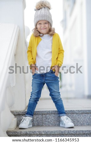 Fashionable child girl in autumn
