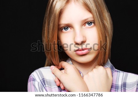 Close up portrait of beautiful teenager girl with sad depressed facial expression. Pretty young woman with long blonde hair looking stressed and worried. isolated background, copy space.