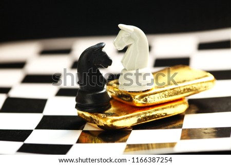 Gold bar on chess board scene.