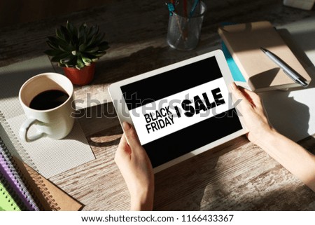 Black friday sales banner on device screen. E-commerce, internet business and digital marketing.