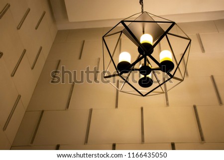 Picture of modern metallic stylish hang ceiling lamp with beautiful wall background