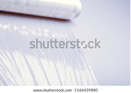 Cellophane packaging tape on whte desk background. Roll