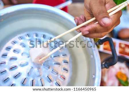 Thai barbecue pork (Moo-Ka-Ta)  - famous Thai local food with need to do own cooking - food photography concept