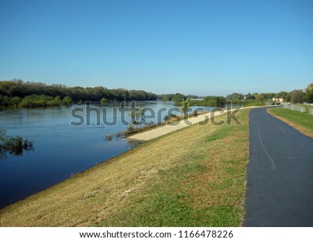 Wisconsin River in summer as viewed from the Portage levee Royalty-Free Stock Photo #1166478226