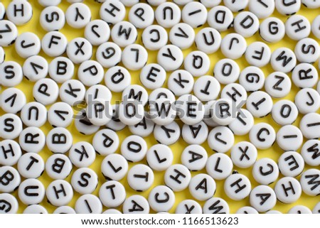 The word POWER made of white rounded blocks that lays on other blocks with letters. Symbol of power, authority, domination, command