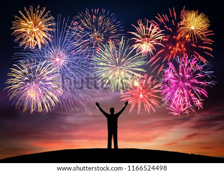 Happy man on celebration background with colorful firework. Anniversary, festival, party and holidays abstract concepts.