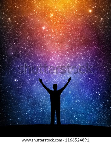 Man silhouette on a night sky background with bright stars. Man watching the stars. Science, education and religion team concept background. Elements of this image furnished by NASA.