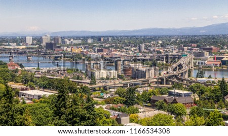 Downtown Portland View. Portland, Oregon’s largest city, is known for its parks, bridges and bicycle paths, as well as for its eco-friendliness and its beer and coffee.