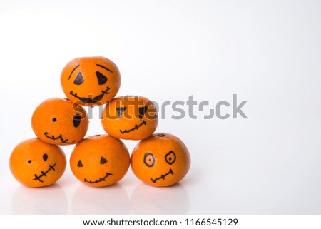 Horizontally background for Halloween with a pyramid of tangerines pumpkins (close up)