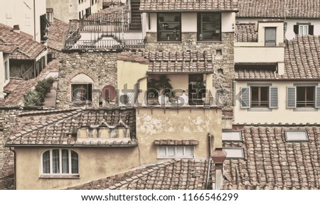 Home sweet home. Soft pink pastel. Urban landscape. Residential buildings with tile roofs in the city. Matte vintage. Desaturated texture. 