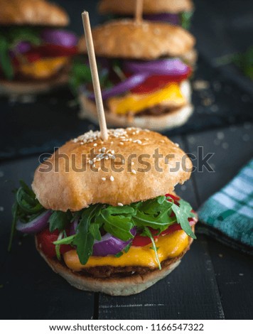 Close-up of homemade fresh burger on dark background