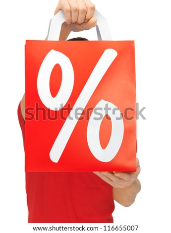 closeup picture of man's hands holding shopping bag
