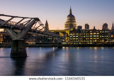 Night panorama of the river Thames with the London Millennium bridge and the dome of St Paul's Cathedral, London, United Kingdom. The St Paul's Cathedral is one of the main churches of the city