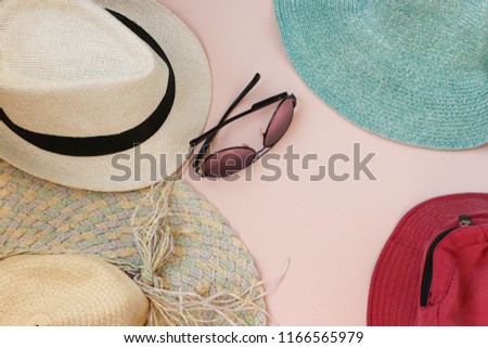 Set Beach. Summer time. Man Woman Hats and Glasses. Top View. Peach Background. Flat Lay Copy space.  