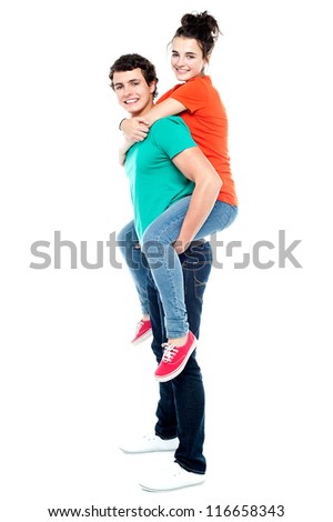 Portrait of loving couple enjoying together while piggyback ride