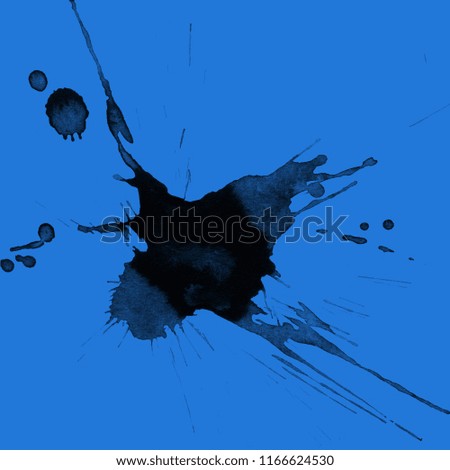 Isolated artistic black watercolor and ink paint splatter textures and decorative elements on blue paper background.