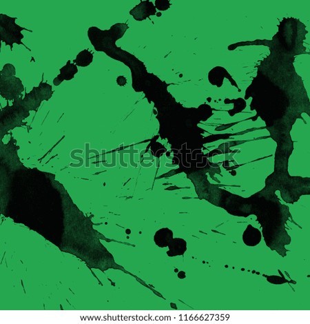 Isolated artistic black watercolor and ink paint splatter textures and decorative elements on green paper background.