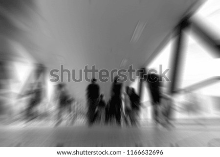 Abstract background of people walk on footbridge at rush hour with B&W color