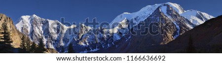 Snow-covered peaks of the Altai Mountains, high contrast landscape, large panorama Royalty-Free Stock Photo #1166636692