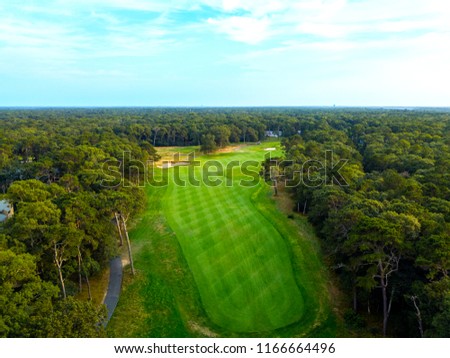 Aerial picture of a hole on a golf course.