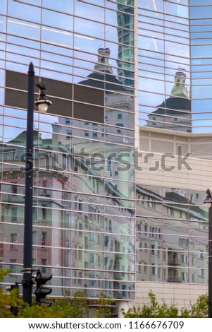 Reflection of buildings in glass facade