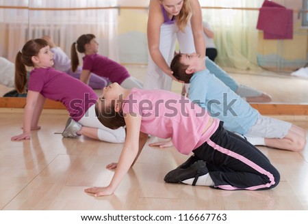group of children engaged in physical training in the gym. Horizontal. Royalty-Free Stock Photo #116667763