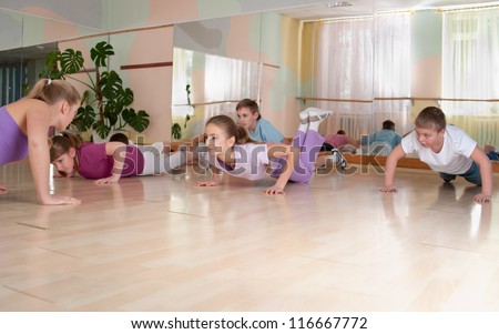 group of children engaged in physical training in the gym. Horizontal. Royalty-Free Stock Photo #116667772