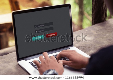 Man working and sign in membership username password on laptop / computer at the park / outdoor