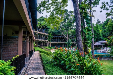 resort building in green tree garden with swimming pool at Samed Hideaway Resort Samed island rayong thailand
