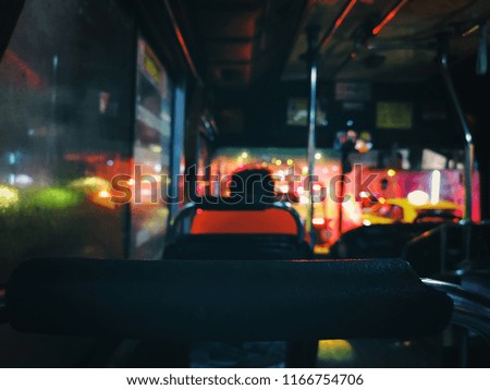 Blurred night lights on the bus driving that traffic jam in asia.