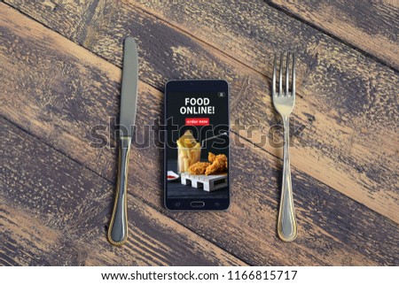 Mobile phone with order food online word on screen. Online food marketing concept. Blogging concept. Royalty-Free Stock Photo #1166815717