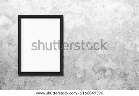 White poster Or a white picture frame hanging on the brick wall background in the room.Have space for your message.