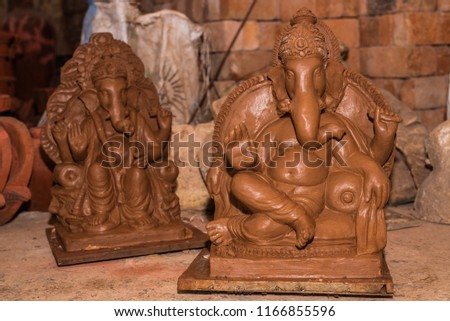 Unfinished Clay model of Lord Ganesh\Ganesha being prepared by local artisans in India before the Hindu festival Ganesh Chaturthi 
