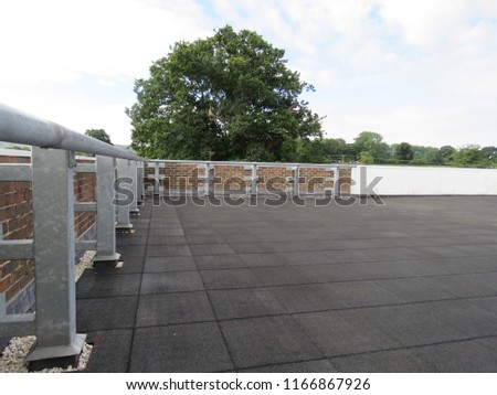 Promenade tiles on a flat roof Royalty-Free Stock Photo #1166867926