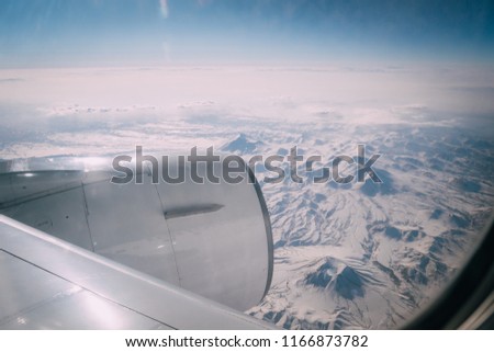 view of mountains from airplane window