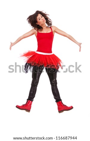 picture of a modern ballerina jumping and raising her shoulders with arms to the side
