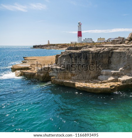 Portland Bill Lighthouse with Turquoise Sea on a Sunny Day Royalty-Free Stock Photo #1166893495