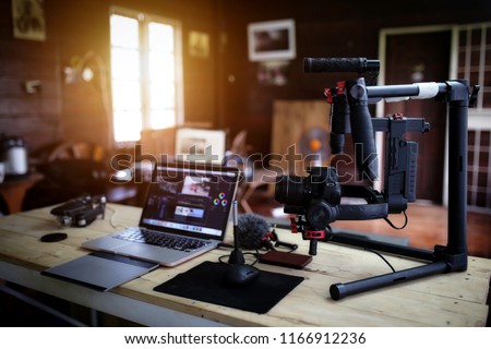 Vlogger equipment for Filming a movie or a video blog Drone Steadicam Camera Stabilizer and laptop. Royalty-Free Stock Photo #1166912236