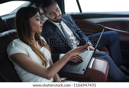 Conversation of two business people in driving car