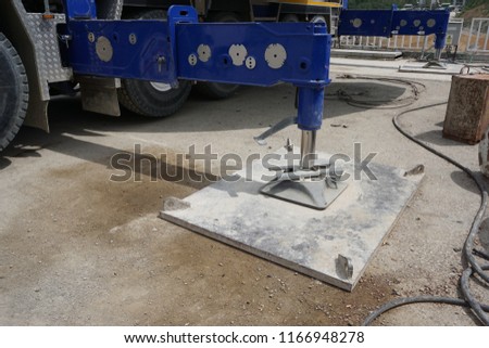 Steel base plate for mobile crane's outrigger leg Royalty-Free Stock Photo #1166948278