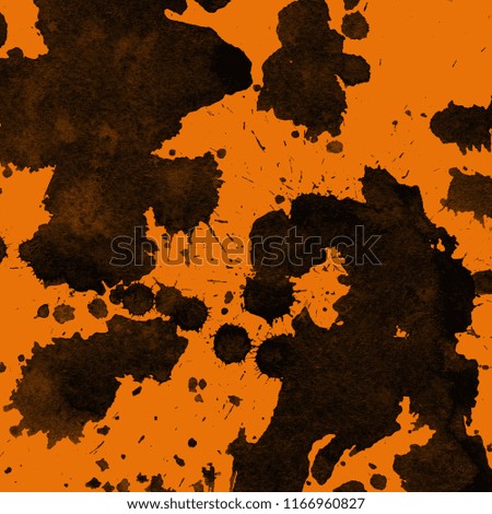 Isolated artistic black watercolor and ink paint splatter textures and decorative elements on orange paper background.