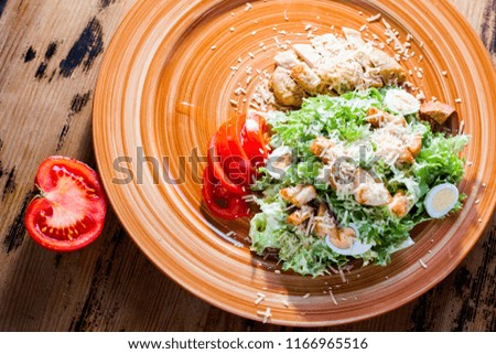 delicious salad with chicken, eggs, crackers and herbs