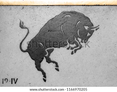 ancient horoscope sign Taurus, in black and white marble, on the Milan cathedral floor